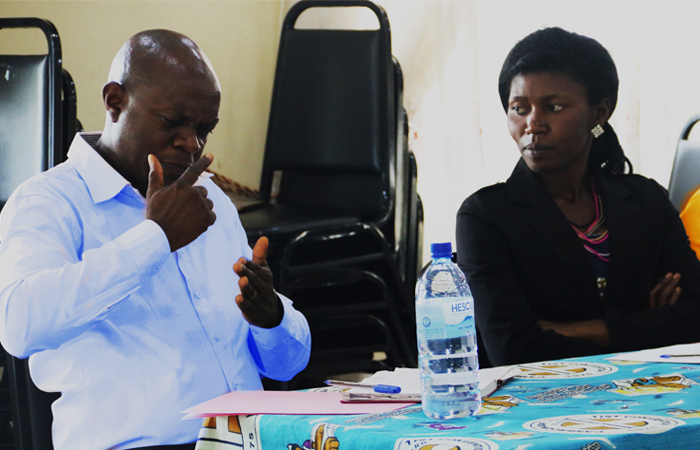 Glory (Right) always seats besides her interpreter Mr Che Manasseh (Left) during important meetings.